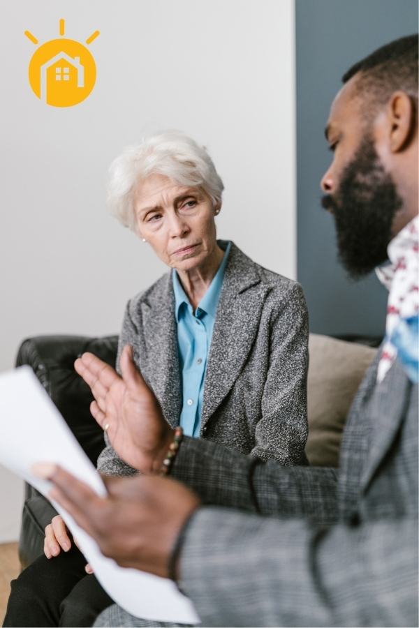 Photo of Note Buyer Talking to Woman